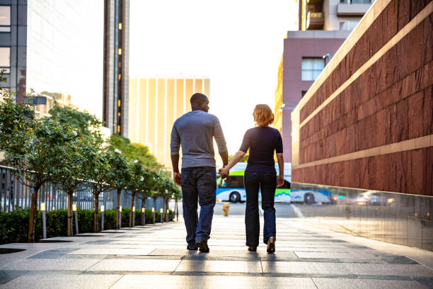 istock LA Couple Holding Hands in Downtown at Sunset 996260690