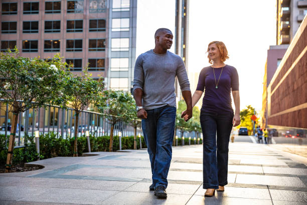 istock LA Couple Holding Hands in Downtown at Sunset 996260696