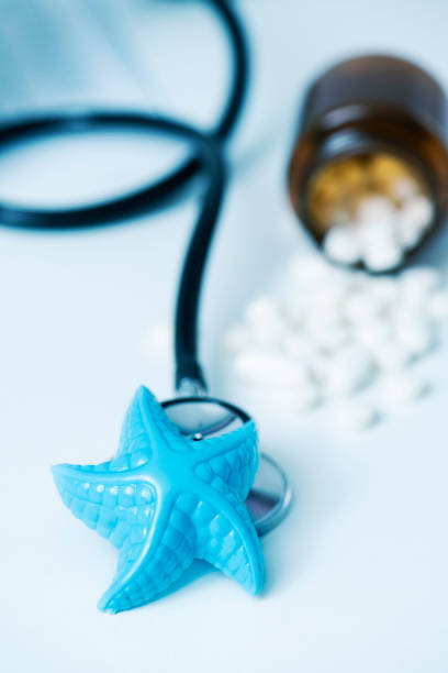 istock starfish and pills on the doctors desk 996265568