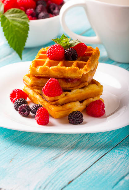 istock waffle dessert fruit berries fresh sweet wooden background. 996266662