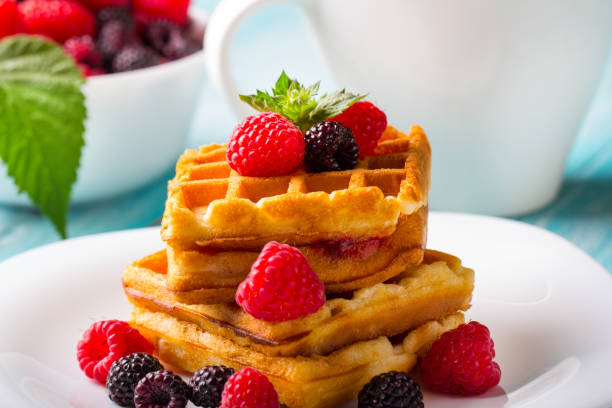 istock waffle dessert fruit berries fresh sweet wooden background. 996267732