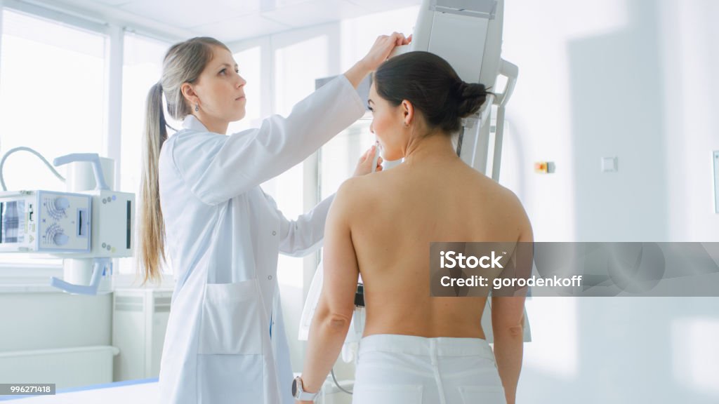 In the Hospital, Female Patients Undergoes Mammogram Screening Procedure Done by Mammography Technologist. Modern Technologically Advanced Clinic with Professional Doctors. Breast Cancer Prevention Screening. Mammogram Stock Photo
