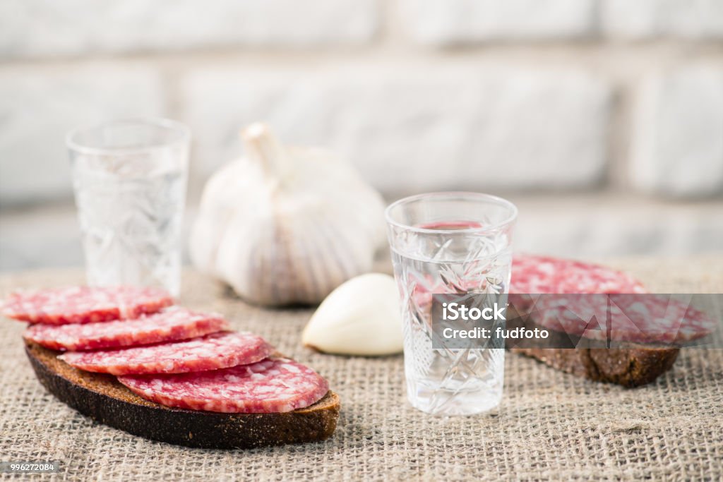 sausage sandwich and a shot of vodka sausage sandwich and a shot of vodka, natural product Alcohol - Drink Stock Photo