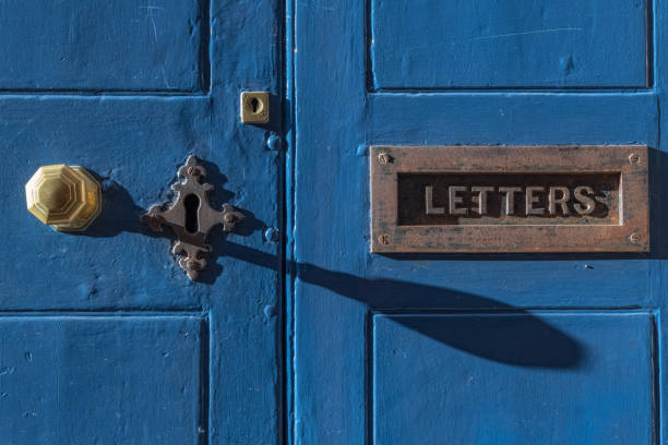 istock Blue door with vintage brass letter box 996273272