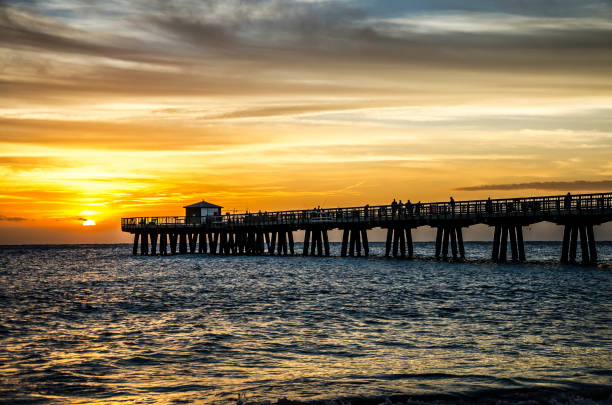 istock Pompano Beach, FL Pier at Sunrise from the Shoreline view from the north side 996279954