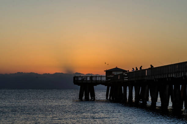 istock Pompano Beach, FL Pier at Sunrise from the Shoreline view from the north side 996282088