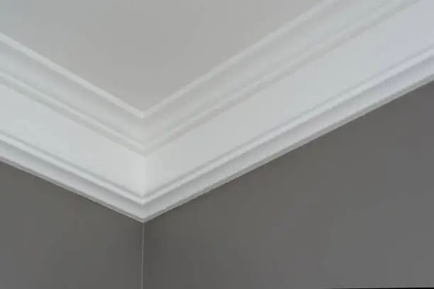 Details in the interior close-up. Ceiling moldings, part of intricate corner