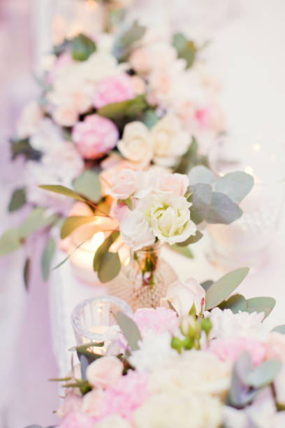 istock flower composition with roses, eucalyptus, chrysantemums in crystal vases 996286114