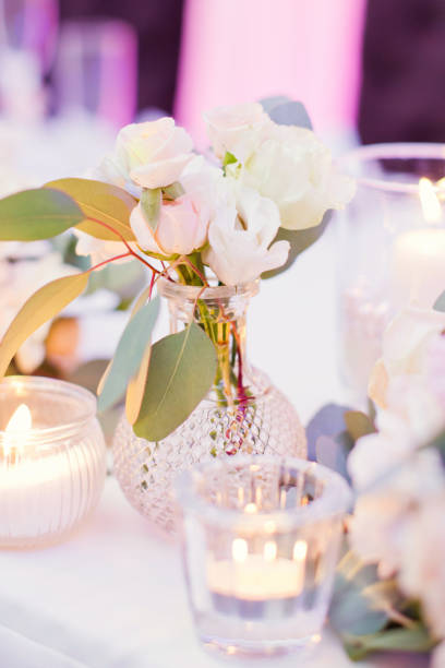 istock flower composition with roses, eucalyptus, chrysantemums in crystal vases 996286132