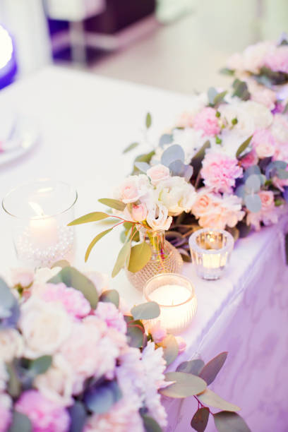 istock flower composition with roses, eucalyptus, chrysantemums in crystal vases 996286390