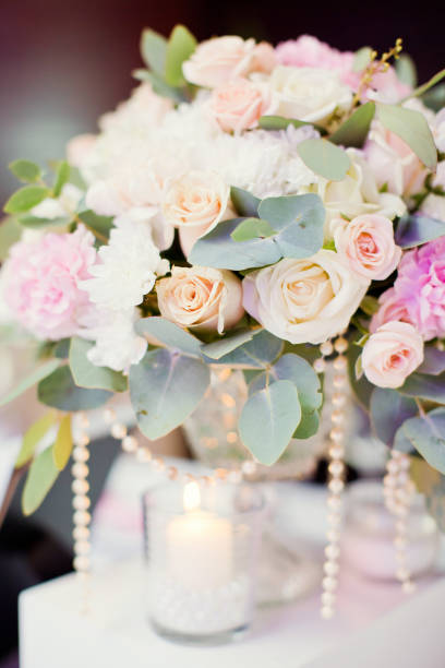 istock flower composition with roses, eucalyptus, chrysantemums in crystal vases 996286544