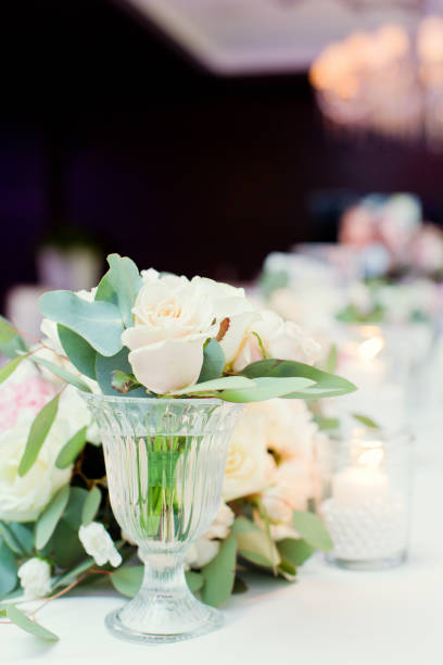 istock flower composition with roses, eucalyptus, chrysantemums in crystal vases 996286590