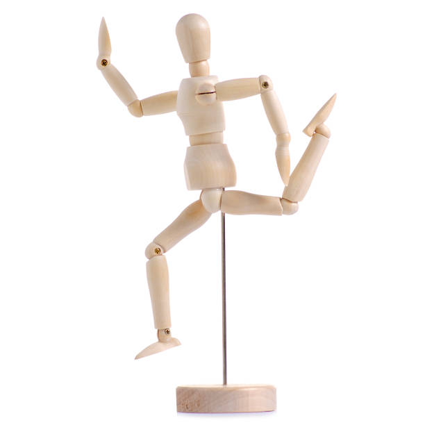 istock Wooden figure of a man exercises 996290510