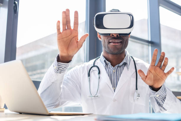 istock Cheerful young doctor testing wearable glasses 996298130