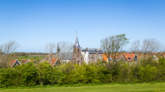 Village Oudeschild with Martinus church and trraditional gable  houses on the Wadden island Texel in the Netherlands