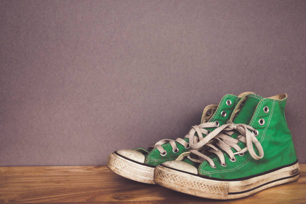 istock green shoe, sneakers with filter effect retro vintage style 996308312