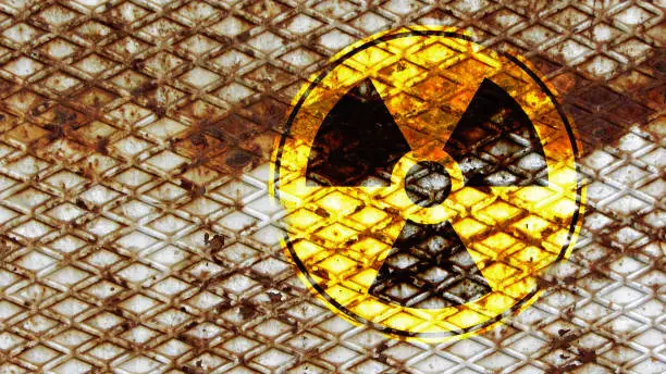 Sign for radioactivity on a rusty metal surface
