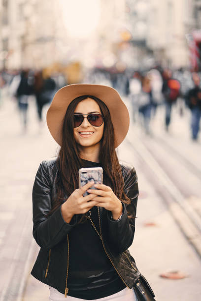 istock girl with phone in istanbul 996334834