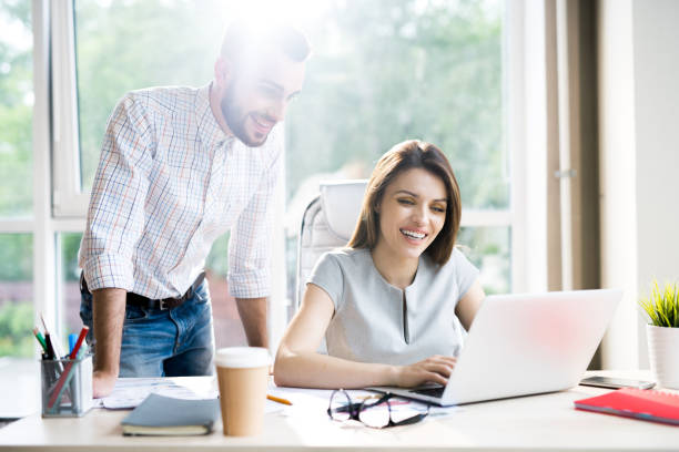 istock Business Partners Working in Sunlit Office 996335208