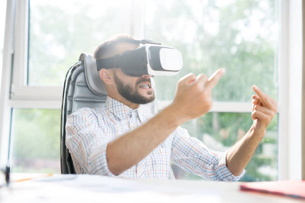istock Handsome Man in VR Showing Middle Finger 996335368