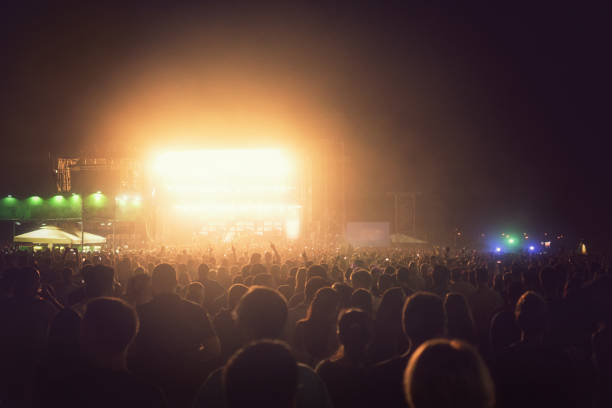 istock Cheering Crowd Enjoying at Music Festival 996339242
