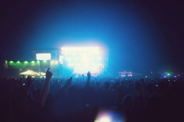 istock Cheering Crowd Enjoying at Music Festival 996340138