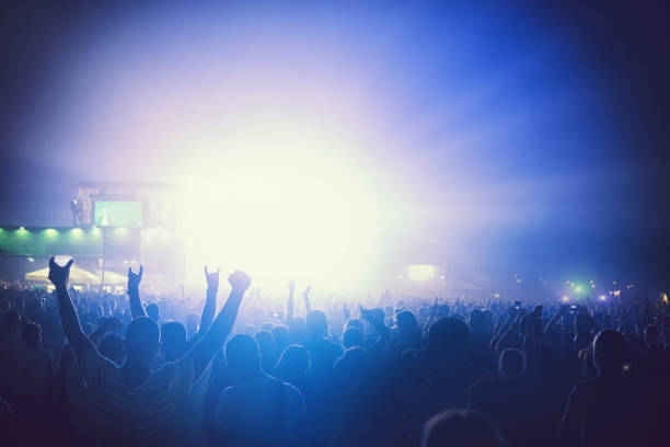 istock Cheering Crowd Enjoying at Music Festival 996340182