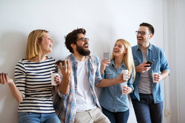 istock Group of young friends is having a heavy laugh during their coffee break. 996340848