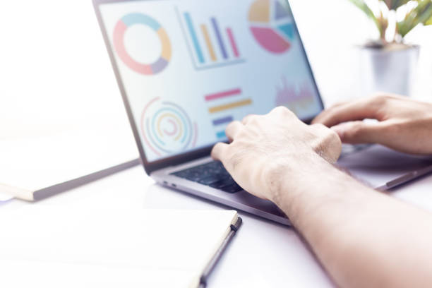 istock Business at work. workspace at office desk and typing on a laptop 996341364