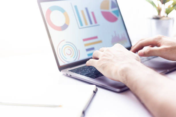 istock Business at work. workspace at office desk and typing on a laptop 996341368