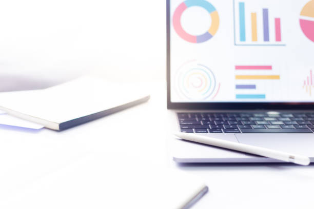 istock Business at work. workspace at office desk and typing on a laptop 996341394