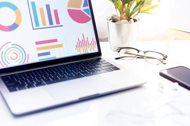 istock Business at work. workspace at office desk and typing on a laptop 996341410