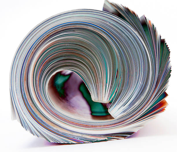 rolled up magazine  isolated on white macro i - tabloid newspaper rolled up journalist imagens e fotografias de stock