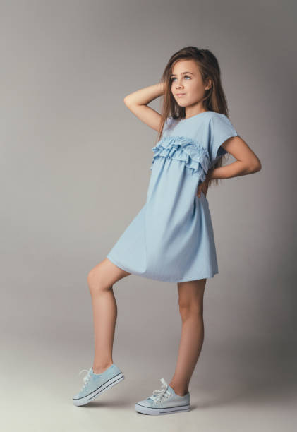 istock child in the Studio posing in fashionable clothes 996341966