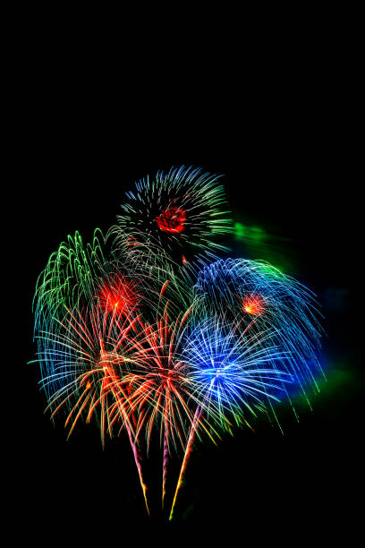 istock Beautiful colorful isolated firework display for celebration happy new year and merry christmas on black background 996348630