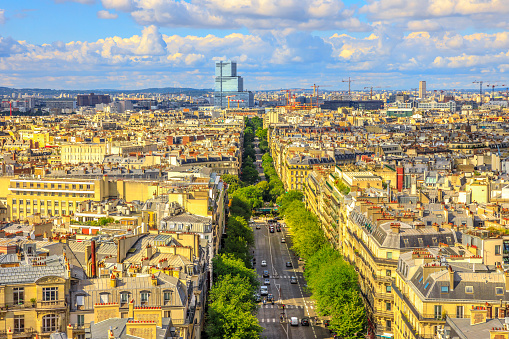 Aerial view of Paris skyline from Arc de Triomphe in a beautiful sunny day with blue sky. Avenue de Wagram from Triumphal Arch. Paris Capital of France in Europe. Scenic urban cityscape.