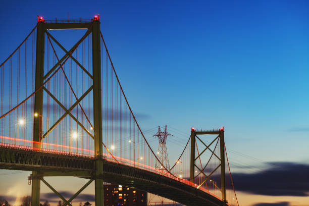 MacKay Bridge A. Murray MacKay bridge spanning Halifax harbour.  Long exposure. mackay stock pictures, royalty-free photos & images