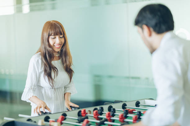 istock Happy couple on weekend and enjoy on vacation,playing foosball 996371808