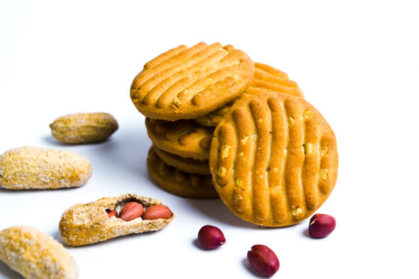 Biscuits with peanuts on white background