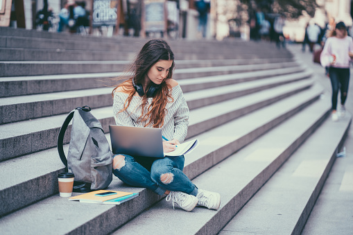 Student studying outside in London