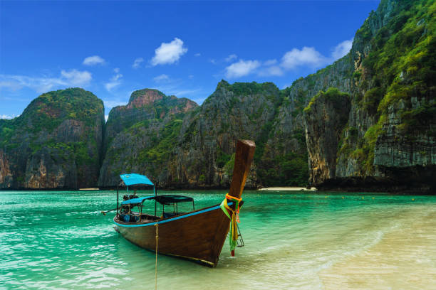 istock Boat on shore of tropical beach 996380724