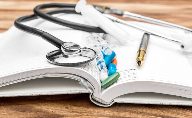 istock Medicaments with stethoscope and pen on opened notepad. Close up. 996398622