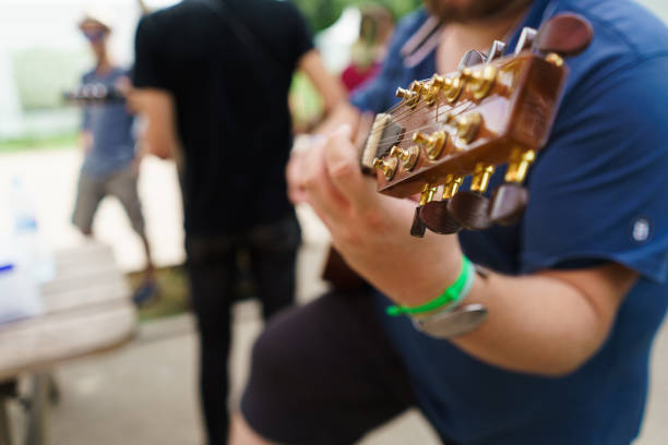 istock Person playing guitar 996402094