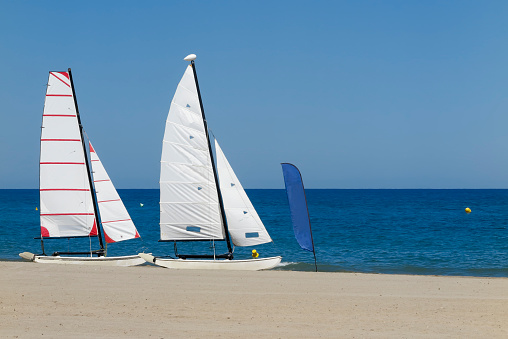horizontal view of two catamaran in the seashore on a sunny day