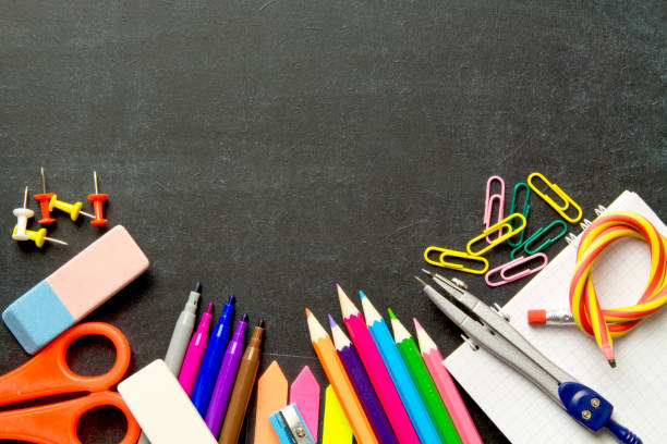 istock School supplies on blackboard background . The concept of education, study, learning, elearning. Back to school 996413010