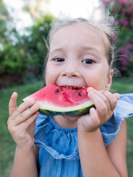 istock Little girl eating watermelon 996415568