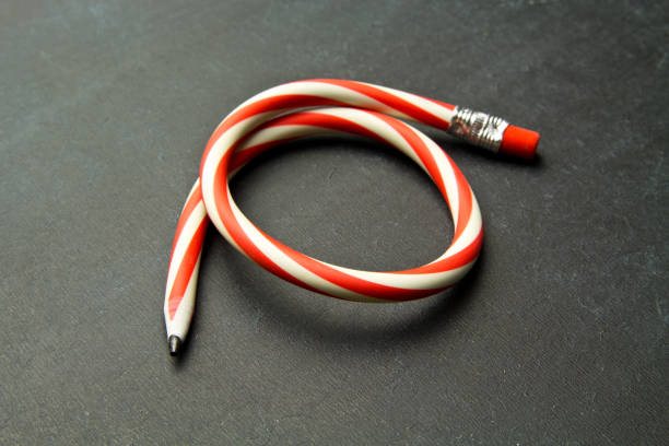 istock Flexible pencil on a  background. Bent pencils  two-color 996416348