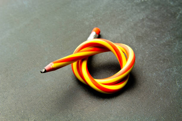 istock Flexible pencil on a  background. Bent pencils  two-color 996416440