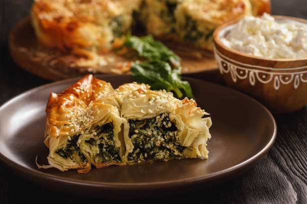 Burek or borek, balkanian puff pastry with spinach. Burek or borek, balkanian puff pastry with spinach. filo pastry stock pictures, royalty-free photos & images