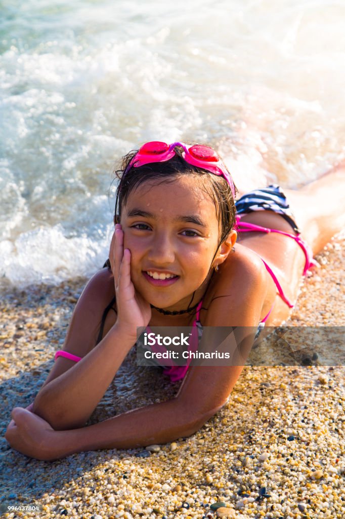 Happy Teen Girl On Beach Having Fun At The Sea Stock Photo - Download Image  Now - Azerbaijan, Beach, Beach Holiday - iStock